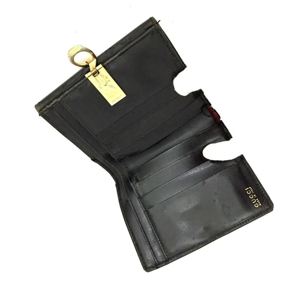 Gucci, black glossy leather, bi-fold style, rectangular, wallet with multiple pockets, tons of card slots, and a gold, hinged G clasp