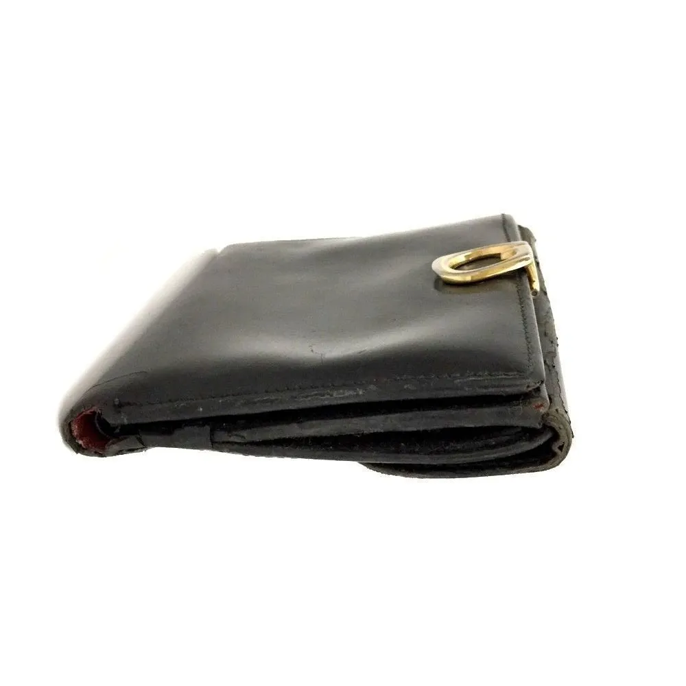 Gucci, black glossy leather, bi-fold style, rectangular, wallet with multiple pockets, tons of card slots, and a gold, hinged G clasp