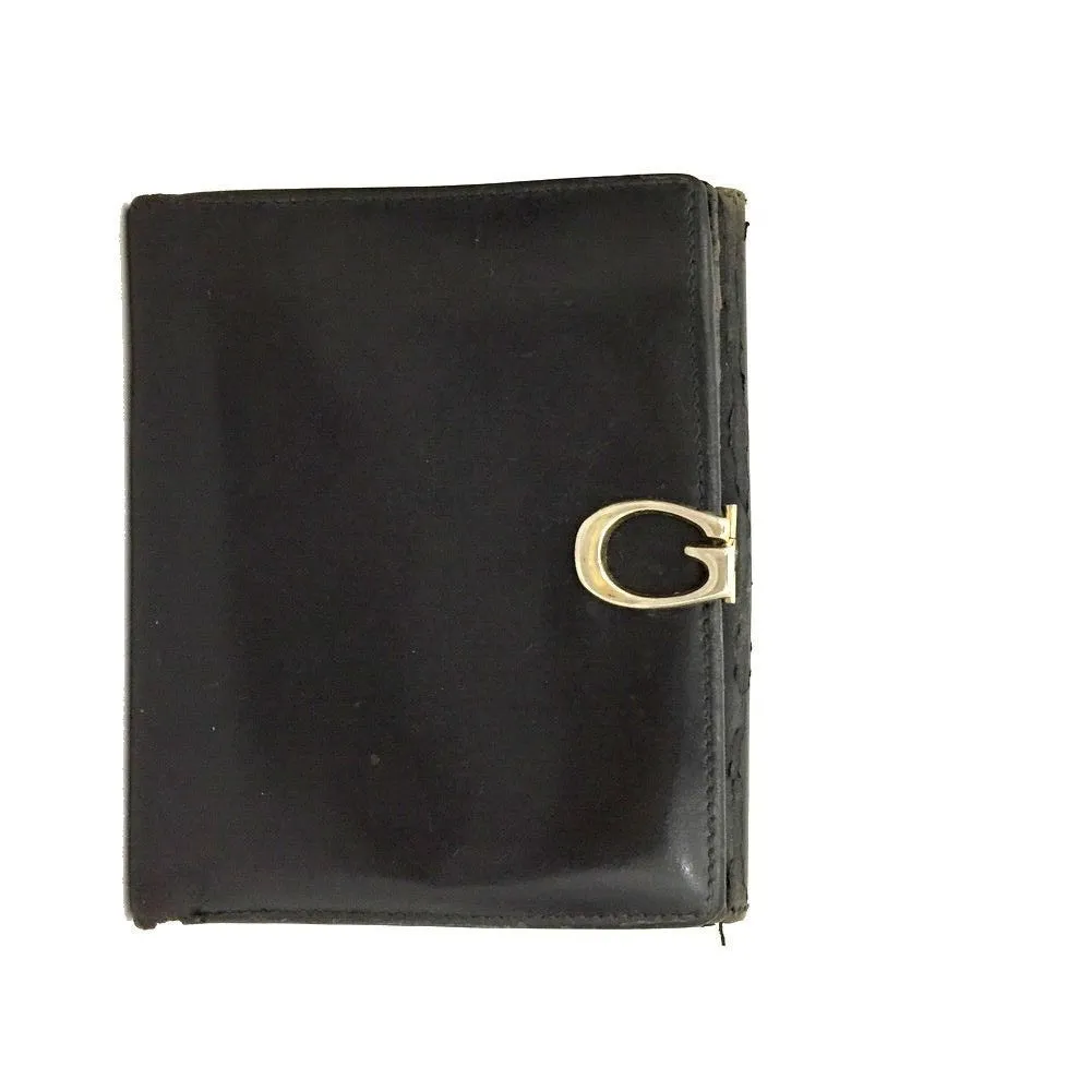 Gucci, black glossy leather, bi-fold style, rectangular, wallet with multiple pockets, tons of card slots, and a gold, hinged G clasp
