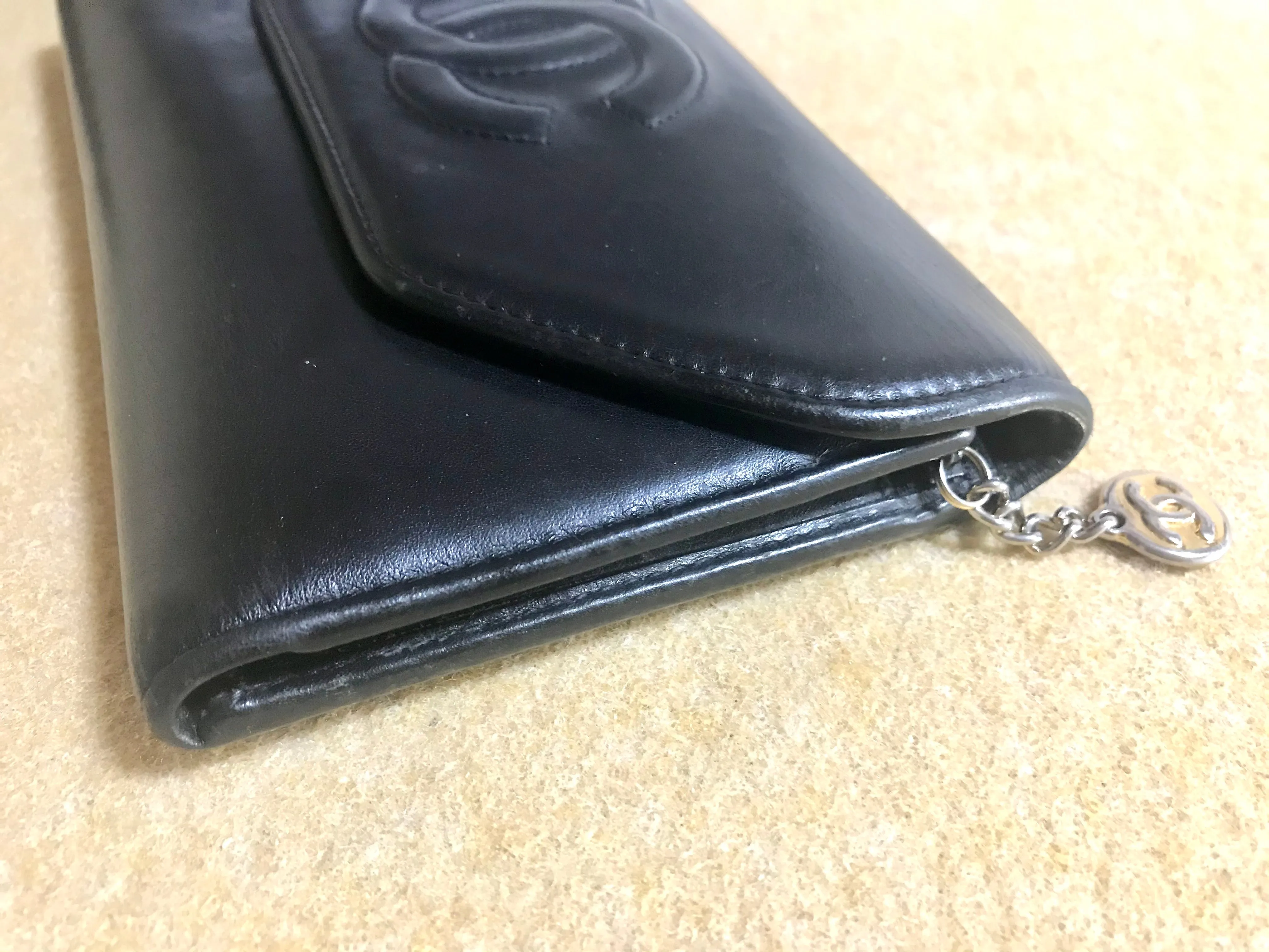 Vintage CHANEL black leather wallet with large CC stitch mark. Rare wallet from Chanel in 90’s.