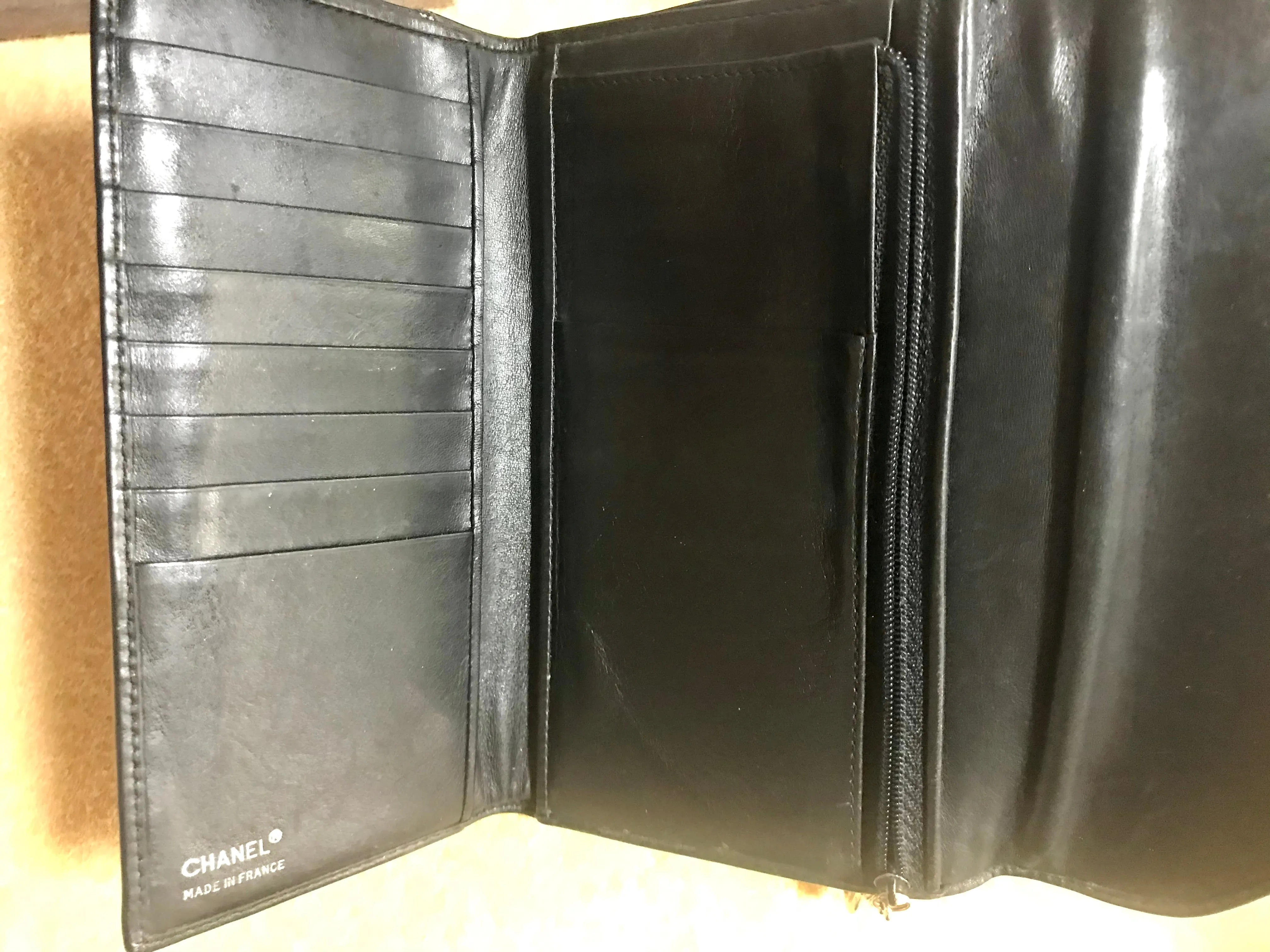 Vintage CHANEL black leather wallet with large CC stitch mark. Rare wallet from Chanel in 90’s.