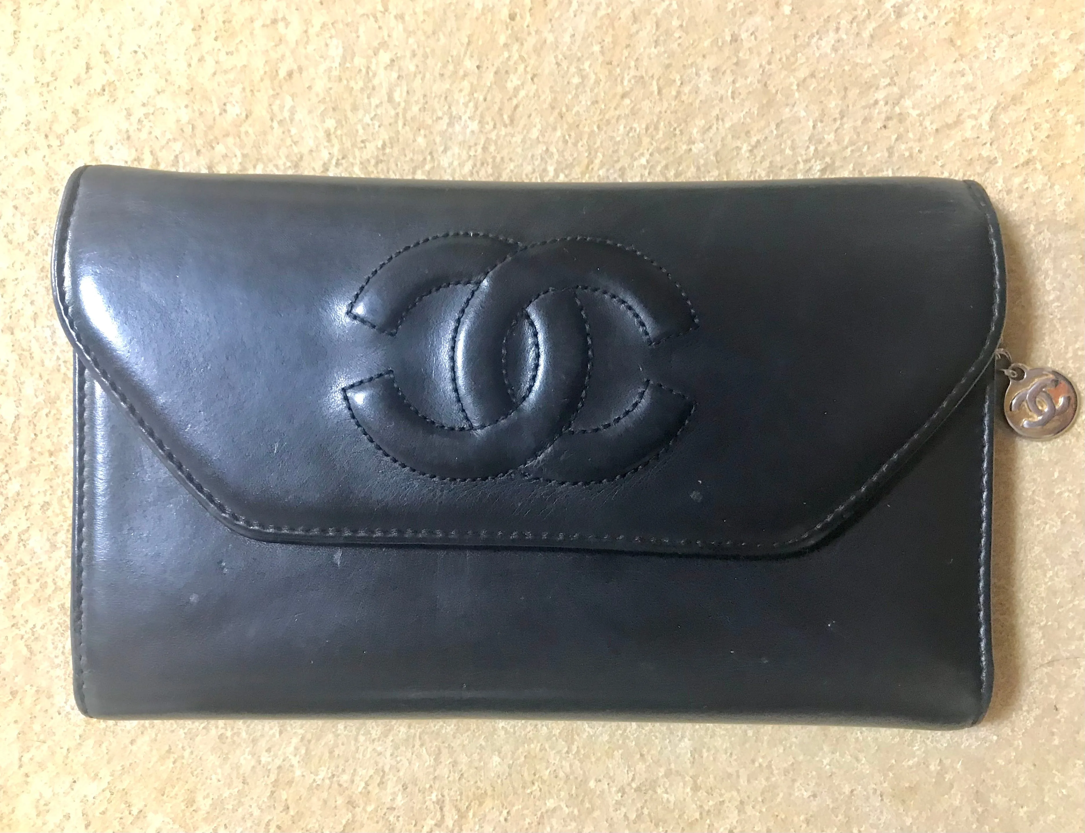 Vintage CHANEL black leather wallet with large CC stitch mark. Rare wallet from Chanel in 90’s.